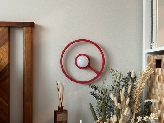 Red wireless ORA sconce turned off