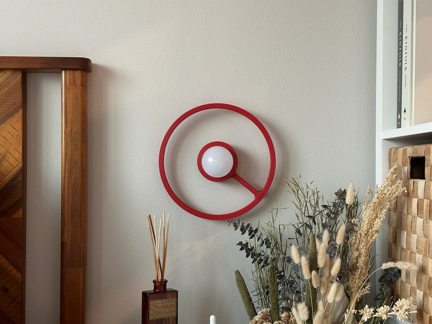 Red wireless ORA sconce turned off
