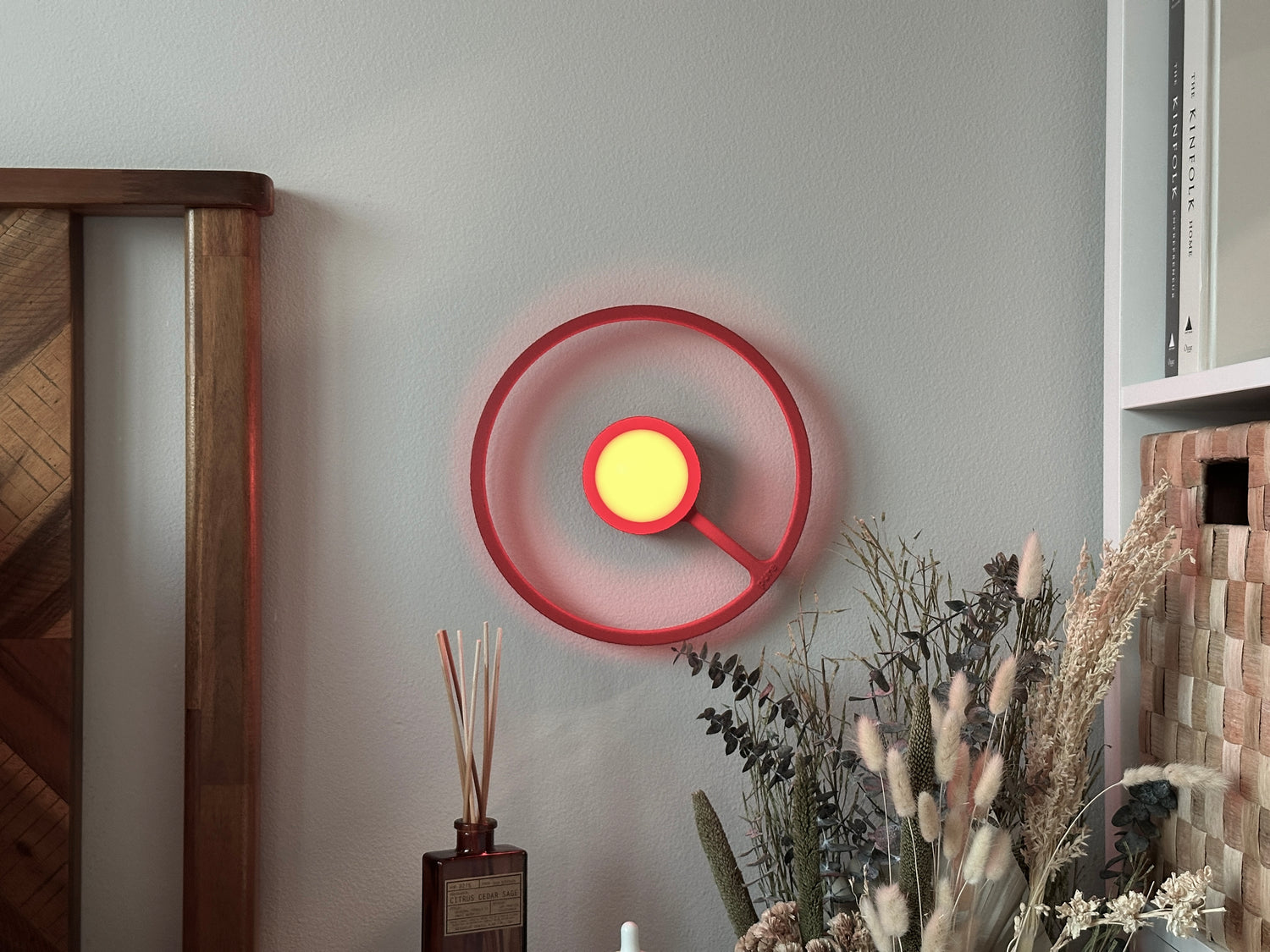 Red wireless ORA sconce. 