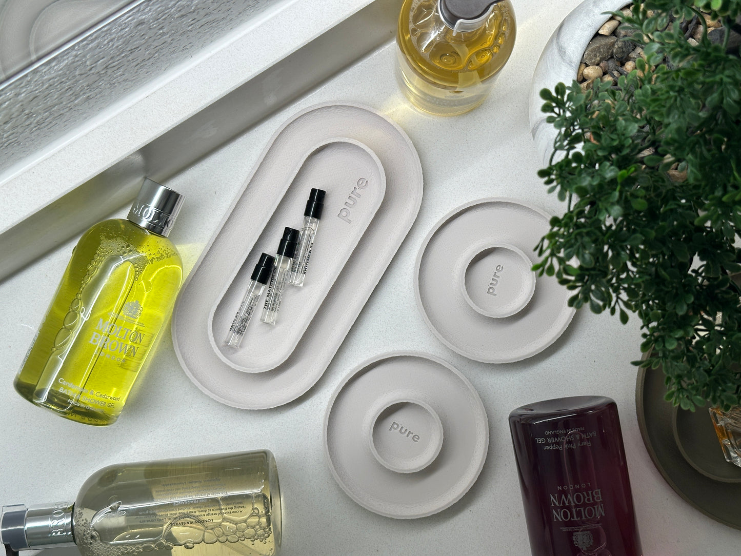 Cream white bathroom tray set used for perfume, jewelry, and small vanity essentials.