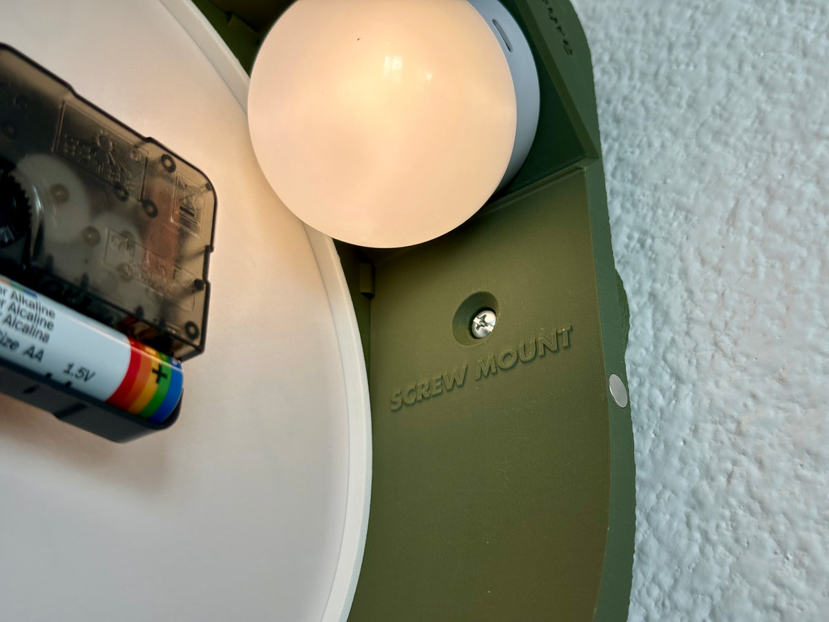 Rear view of the Cero double face clock showing the magnetic clock face, internal quartz movement and rechargeable backlight placement.